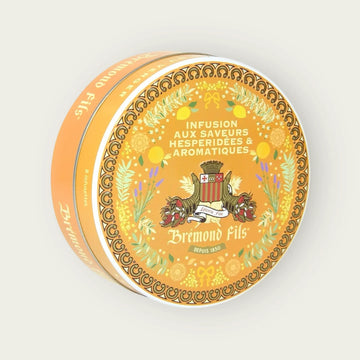 Metalldose mit Bio-Kräutertee von Brémond Fils – zitrisch-aromatische Aromen mit Löwenzahnblättern, grünem Rooibos, Clementine, Süßholz, Orange & Olivenblättern.