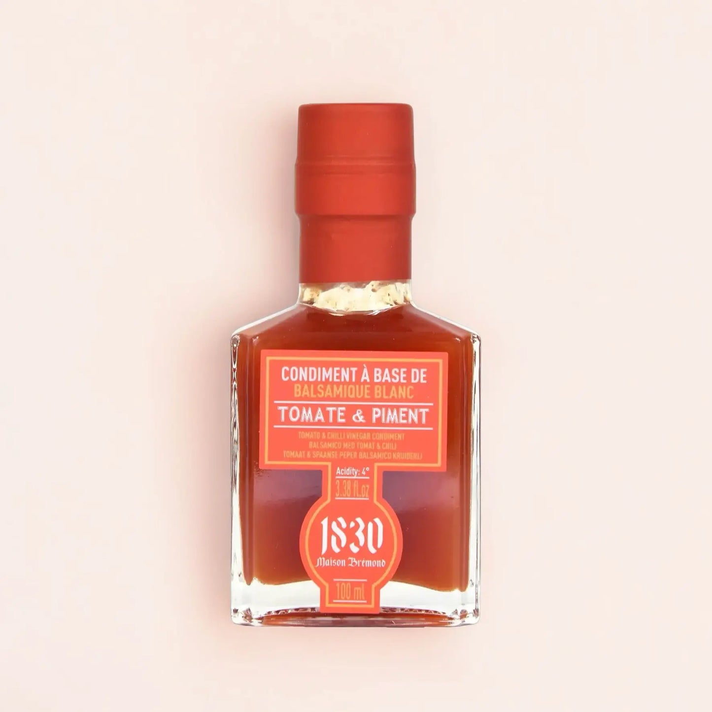 Edle Glasflasche mit Balsamico-Condiment Tomate & Chili (100 ml) von Maison Brémond. Die leuchtend rote Farbe unterstreicht die würzige Kombination aus frischer Tomate und feiner Chili-Schärfe. Perfekt für mexikanische Gerichte, Grillmarinaden und kreative Saucen.