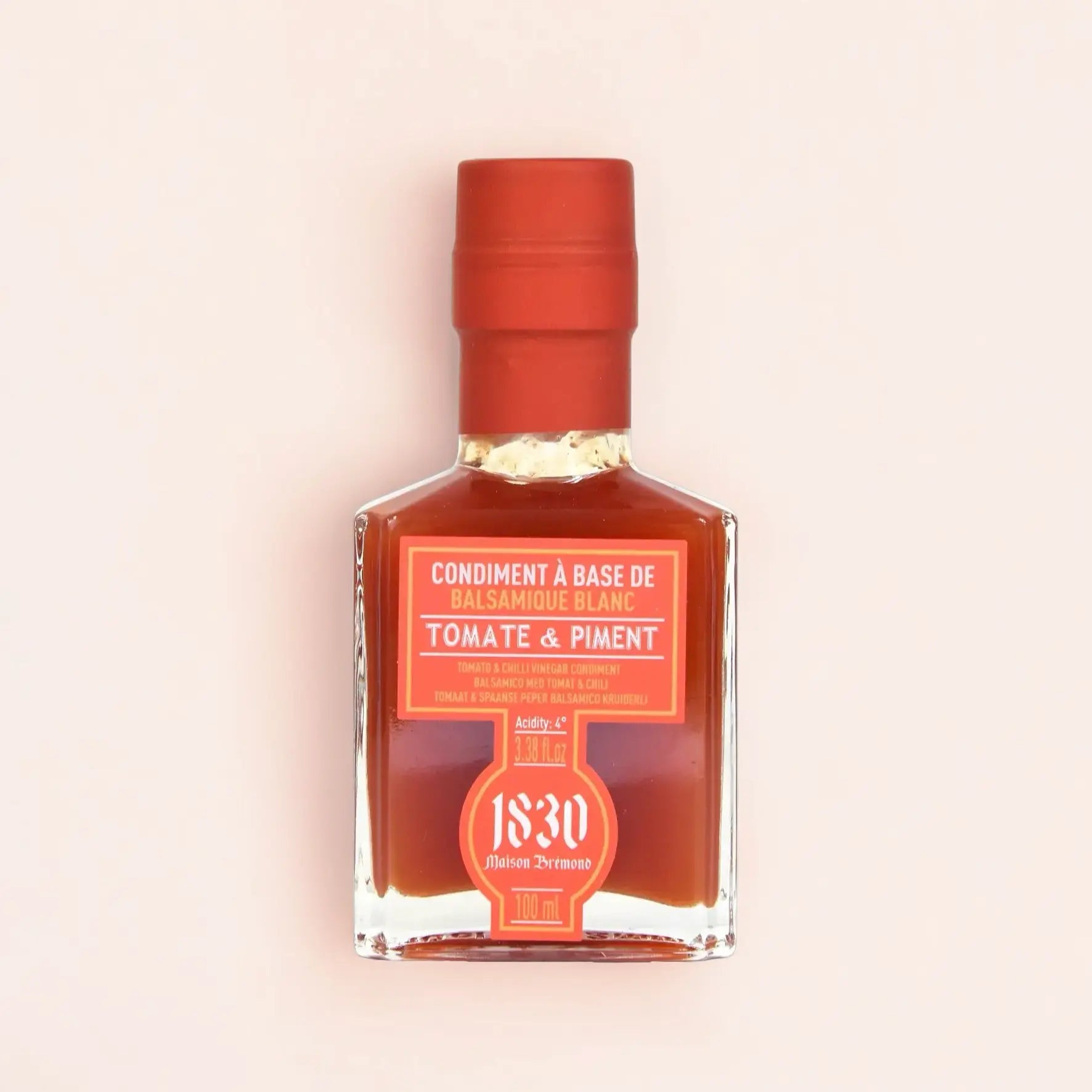 Edle Glasflasche mit Balsamico-Condiment Tomate & Chili (100 ml) von Maison Brémond. Die leuchtend rote Farbe unterstreicht die würzige Kombination aus frischer Tomate und feiner Chili-Schärfe. Perfekt für mexikanische Gerichte, Grillmarinaden und kreative Saucen.