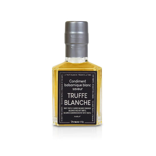 Flasche mit weißem Balsamico-Essig und Weißtrüffel-Aroma, silberner Verschluss, edles schwarzes Etikett mit der Aufschrift "Condiment balsamique blanc saveur Truffe Blanche". Hochwertiges Produkt aus Italien.