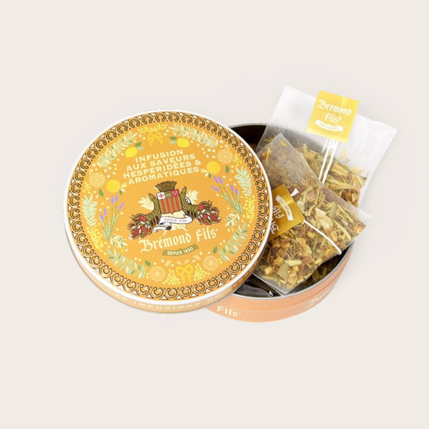 Metalldose mit Bio-Kräutertee von Brémond Fils – zitrisch-aromatische Aromen mit Löwenzahnblättern, grünem Rooibos, Clementine, Süßholz, Orange & Olivenblättern.