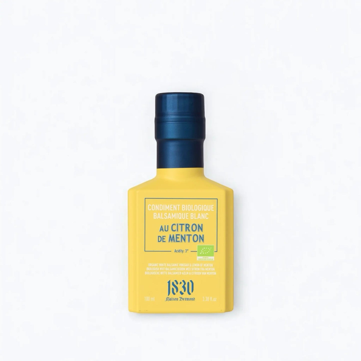 Maison Brémond 1830 Bio Weißer Balsamico Essig mit Zitrone aus Menton in einer eleganten gelben Flasche mit blauem Verschluss.