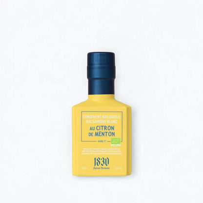 Maison Brémond 1830 Bio Weißer Balsamico Essig mit Zitrone aus Menton in einer eleganten gelben Flasche mit blauem Verschluss.
