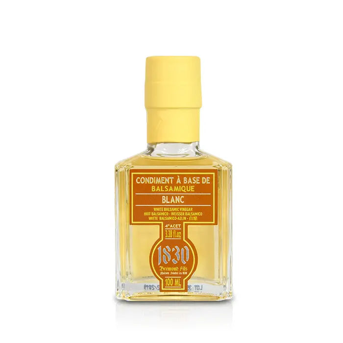 Elegante Glasflasche mit Condimento Bianco – Weißem Balsamico-Essig (100 ml) von 1830 Maison Brémond. Die goldene Farbe des Essigs unterstreicht seine feine Süße und milde Säure. Ideal für Dressings, Marinaden und mediterrane Spezialitäten.