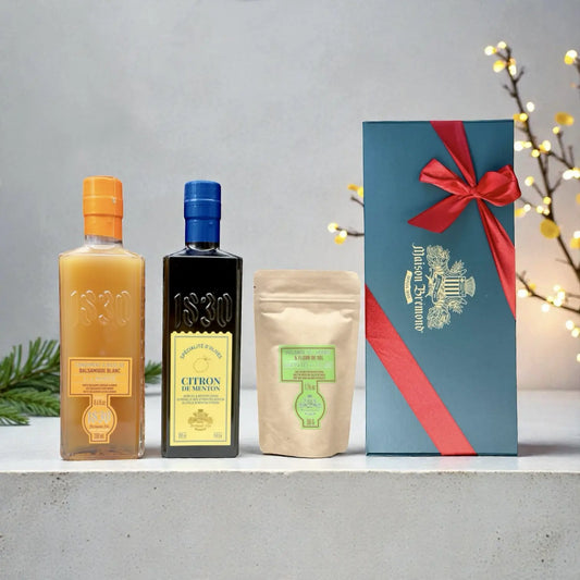 Geschenkset Maison Brémond 1830 mit Olivenöl Zitrone, Mango-Essig und Kräutersalz in edler Geschenkbox mit roter Schleife.