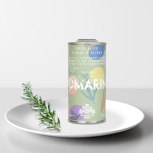 Design-Dose Olivenöl Rosmarin von Maison Brémond 1830, 250 ml, auf einem weißen Teller mit frischem Rosmarinzweig. Extra natives Olivenöl mit aromatischem Rosmarin, ideal für Fleisch, Gemüse und mediterrane Gerichte. Jetzt kaufen.
