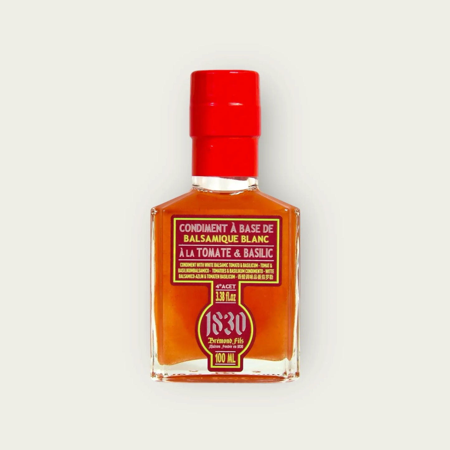 Flasche Tomaten Basilikum Balsamico Essig, 100 ml, mit leuchtend rotem Verschluss und stilvollem Etikett. Ideal für mediterrane Gerichte und kreative Rezeptideen.